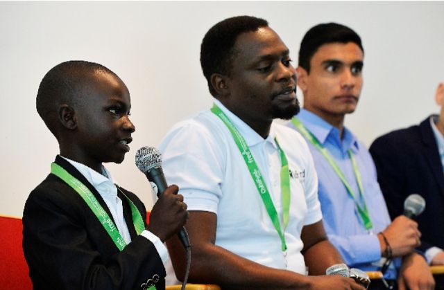 Young boy from Uganda addresses the audience